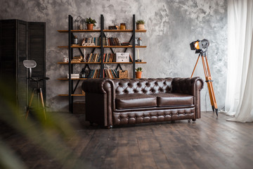 Interior with leather sofa and luxury lamp. Textured background