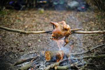 Cooking meat on the grill. Fried food over charcoal. Barbecue weekend. Camping.