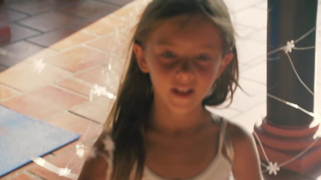 Little beautiful girl in a white suit like an elf