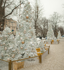 Festive Gifts Decorated with Linen Cord, Cinnamon, Pine cones, Walnuts. Toned image. Snow Drawn