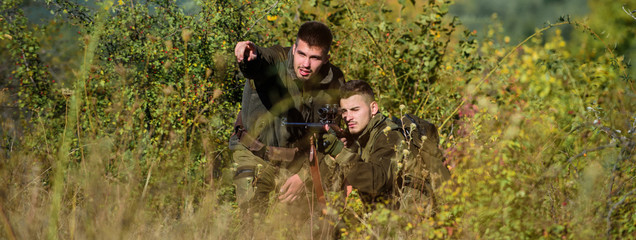 Army forces. Camouflage. Military uniform fashion. Man hunters with rifle gun. Boot camp. Hunting...