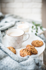 Cozy weekend breakfast with cup of coffee and cookies on ceramic tray