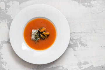 fish soup in white plate