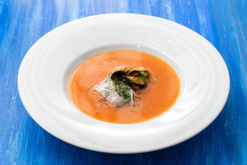 fish soup in white plate