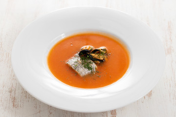 fish soup in white plate