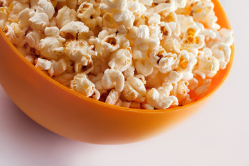 A bowl with popcorn isolated on white background. Food concept