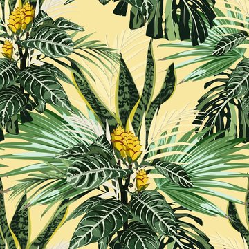 Summer Hawaiian seamless pattern with many types of palm leaves and exotic yellow flowers. Botanical wallpaper, Hawaiian style. Yellow backdrop. © Iuliia