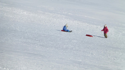 children playing in the snow