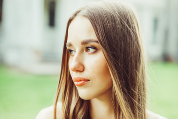 Portrait of tender girl outdoors