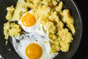 eggs are fried in a frying pan