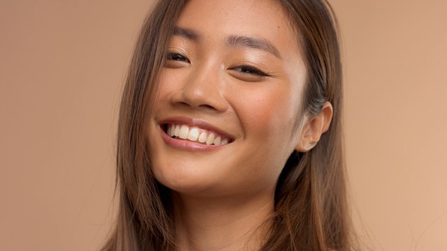 closeup portrait of asian thai japanese model laughingsmiling