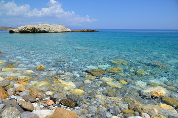Entrance to the sea with a stone bottom, island, summer, island of Crete, Greece