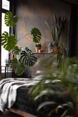 Fotobehang Hotel chique loft style dark bedroom with green plants and textured wall  © barshkiper