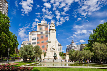 Fototapeta na wymiar Plaza de Espana in Madrid, Spain, with the Cervantes Monument and Edificio Espana, or Spain building, on a summer day. The large square is a tourist attraction and is located at the end of Gran Via