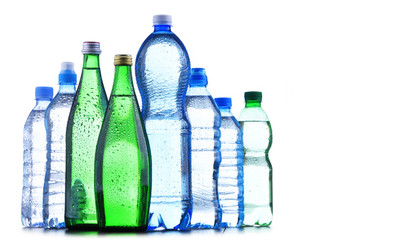 Different sorts of bottles containing mineral water - obrazy, fototapety, plakaty