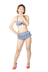 Obraz premium Beautiful Chinese woman wearing a sexy bikini on white background