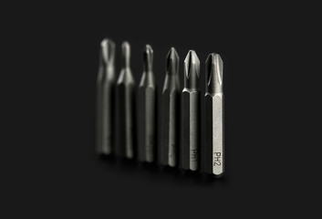 Set of bits for screwdriver. Metal bits for screwdriver. Tool set for household use. Nozzles and adapters for screwdrivers. Head different size hex driver.