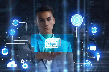 The concept of business, technology, the Internet and the network. A young entrepreneur working on...