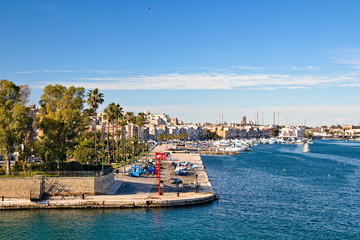 Taranto old town waterfront view on the sea front, steel plant on the background