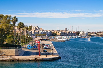 Fototapeta na wymiar Taranto old town waterfront view on the sea front, steel plant on the background