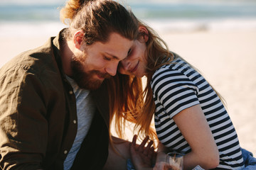 Romantic couple relaxing on the beach