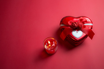 Heart shaped gift box on Red background for Valentine`s Day, Copy Space.