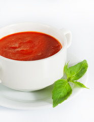 Delicious red tomato soup on white