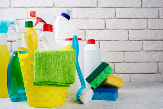 Basket with cleaning products on white background. Cleaning with supplies, cleaning service and clean house concept. Copy space