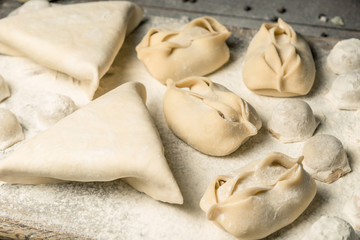 Traditional oriental, Uzbek cuisine, chuchvara, manti and samsa, a set of dishes made in one set