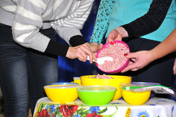 Cooking salad. Female hands prepare food