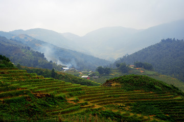 Beautiful landscape with green field on mountains and cloudy sky in Sa Pa, Vietnam