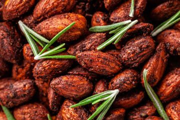 Concept of Spanish cuisine. Snack to wine or beer. Spicy almonds with pecias, rosemary, smoked paprkika, chili pepper, olive oil and salt. The dish is served on a parchment plate. background image