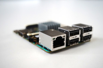 Small single-board computer with USB, Ethernet, HDMI, GPIO and radiator installed