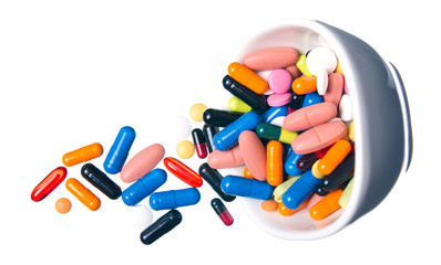 Colorful pills medical white jar on white background top view, pharmacy concept