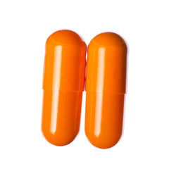 Capsule pills medicine pharmacy orange on white background isolation, top view