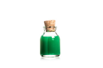 Studio shot of green liquid in glass bottle isolated on white