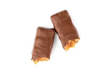 Chocolate bar with caramel and peanut isolated on white background. 