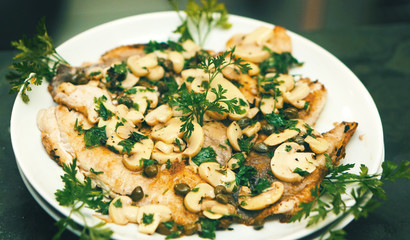Beautiful dish of fish, mushroom and herbs