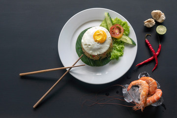 Asian dish fried rice with egg and seafood or beef or chicken