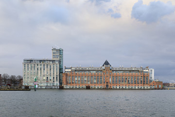 Fototapeta na wymiar Industrial buildings in a harbor of Amsterdam, Netherlands