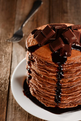 Tasty pancakes with dark chocolate