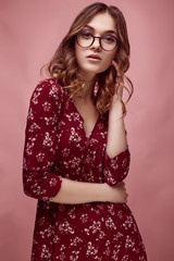 Elegant glamor hipster girl in red fashion dress