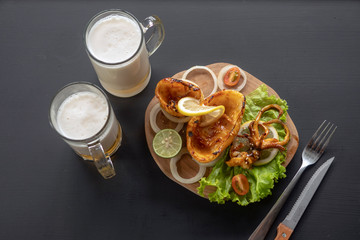 squid, seafood on the wood plate with beer