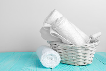 Clean soft towels on wooden table