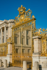 The golden entrance gate of the famous Palace of Versailles