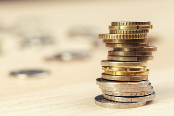 piles of coins on working table