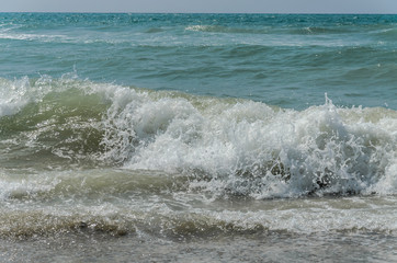 Sea waves on a sandy beach