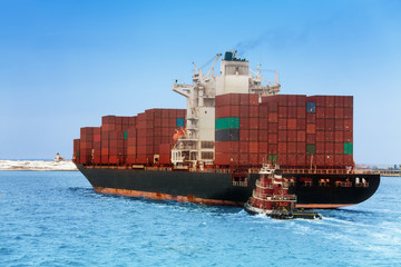 Naklejka premium Tug boat and import export dry cargo ship