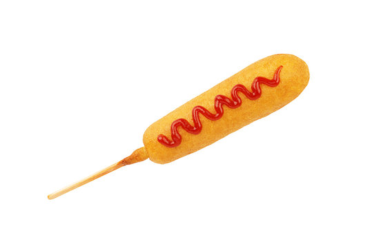 Corn dog with ketchup line on top, isolated on a white background. © michelaubryphoto