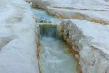 the flow of natural water in the limestone rocks of Pamukkale in Turkish